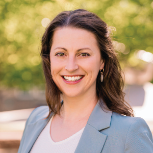 Adrienne Nienow standing outside for a headshot